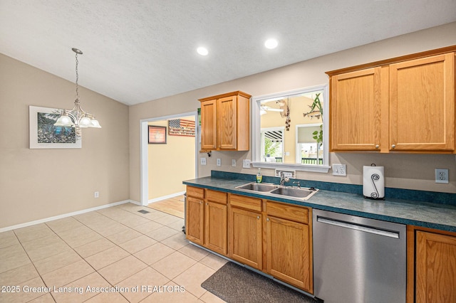 242 Coventry Ln, Mason, MI 48854 - kitchen with dishwasher, vaulted ceiling, dark countertops, light tile patterned floors, and hanging light fixtures
