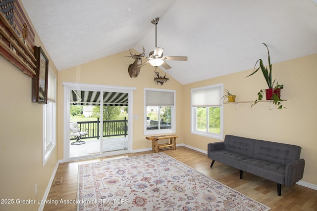 242 Coventry Ln, Mason, MI 48854 - living area featuring ceiling fan, wood finished floors, and high vaulted ceiling