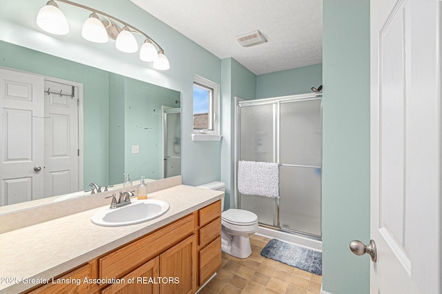 242 Coventry Ln, Mason, MI 48854 - full bath with a stall shower, vanity, and a textured ceiling