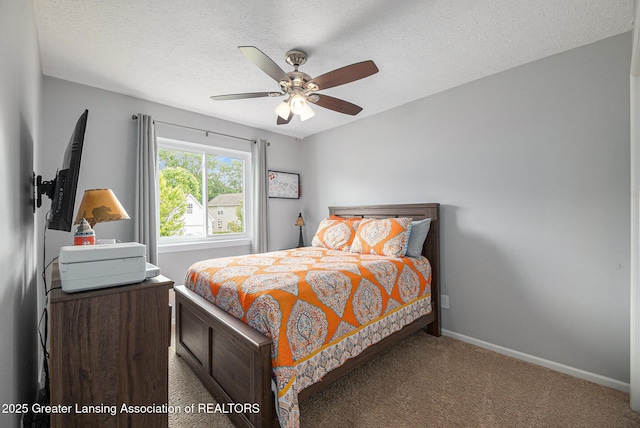 242 Coventry Ln, Mason, MI 48854 - carpeted bedroom with a textured ceiling and ceiling fan