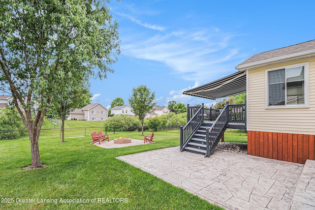 242 Coventry Ln, Mason, MI 48854 - view of yard with an outdoor fire pit, a patio area, a wooden deck, and stairs