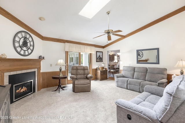 2352 Kings Cross N, East Lansing, MI 48823 - living area featuring wainscoting, light colored carpet, vaulted ceiling, ornamental molding, and wooden walls