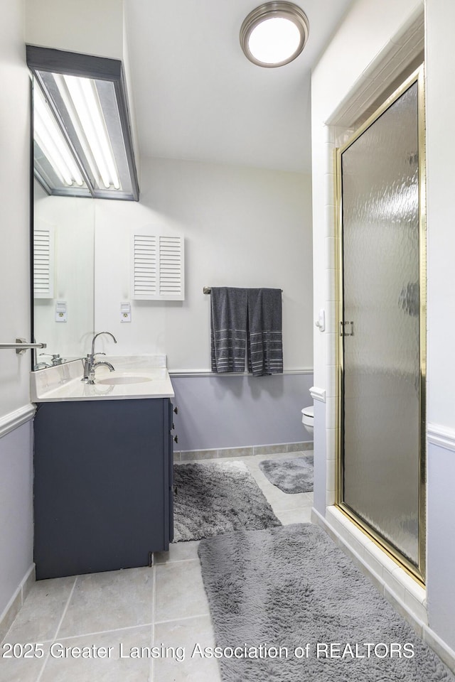 2352 Kings Cross N, East Lansing, MI 48823 - bathroom featuring vanity, a stall shower, and tile patterned flooring