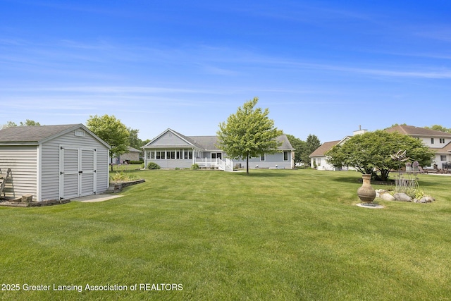 2352 Kings Cross N, East Lansing, MI 48823 - view of grassy yard featuring a shed