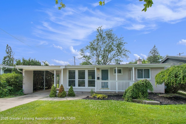 1321 Weber Dr, Lansing, MI 48912 - view of front of property featuring a porch, concrete driveway, a front yard, a chimney, and a carport