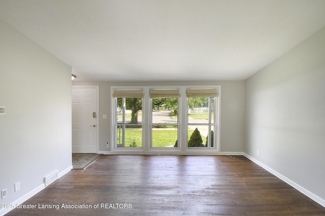 1321 Weber Dr, Lansing, MI 48912 - unfurnished room featuring wood finished floors and baseboards