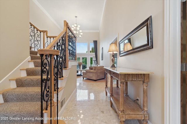 6378 E Island Lake Dr, East Lansing, MI 48823 - stairway featuring a chandelier and ornamental molding