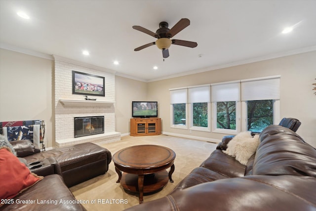 6378 E Island Lake Dr, East Lansing, MI 48823 - carpeted living room featuring a ceiling fan, ornamental molding, recessed lighting, and a fireplace
