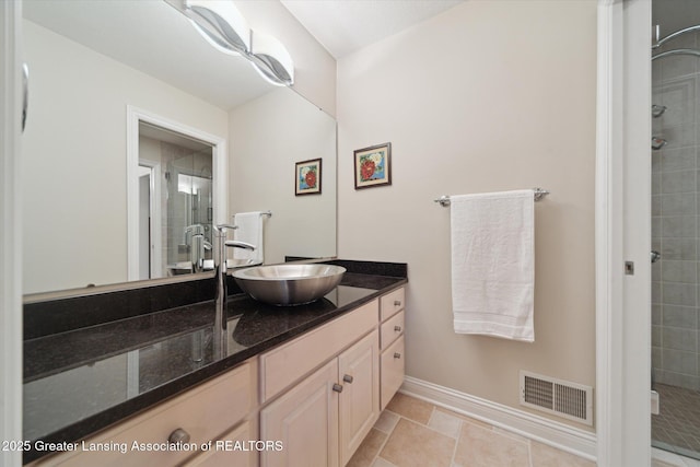 6378 E Island Lake Dr, East Lansing, MI 48823 - bathroom featuring vanity and a stall shower