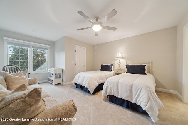 6378 E Island Lake Dr, East Lansing, MI 48823 - bedroom featuring light carpet and a ceiling fan