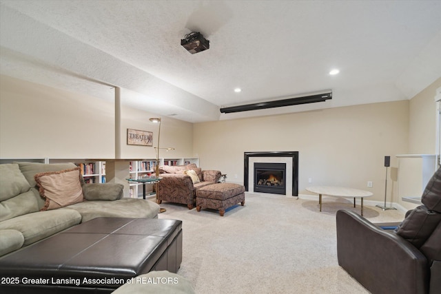 6378 E Island Lake Dr, East Lansing, MI 48823 - living area featuring carpet flooring, a glass covered fireplace, and recessed lighting