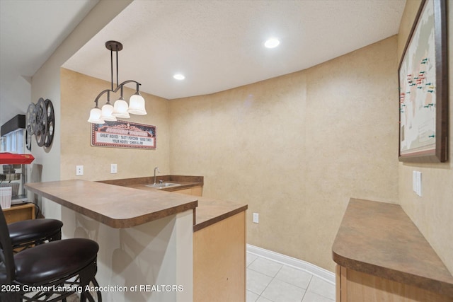 6378 E Island Lake Dr, East Lansing, MI 48823 - bar area featuring light tile patterned floors, pendant lighting, and recessed lighting