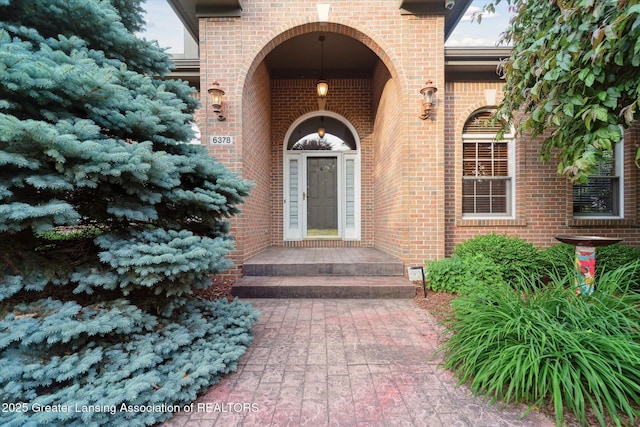 6378 E Island Lake Dr, East Lansing, MI 48823 - view of exterior entry with brick siding