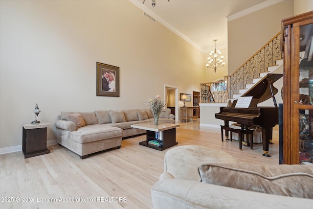 6378 E Island Lake Dr, East Lansing, MI 48823 - living area with a chandelier, ornamental molding, stairs, wood finished floors, and a high ceiling