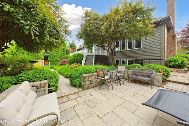 6378 E Island Lake Dr, East Lansing, MI 48823 - view of patio / terrace featuring stairs and outdoor dining area