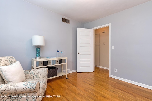 619 Wayland Ave, East Lansing, MI 48823 - sitting room with wood finished floors and baseboards