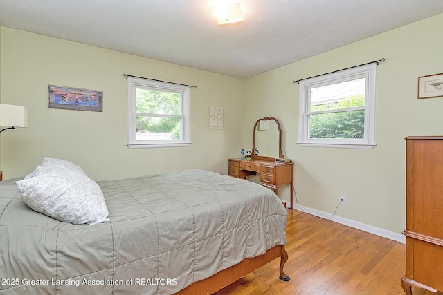 619 Wayland Ave, East Lansing, MI 48823 - bedroom featuring light wood finished floors and baseboards