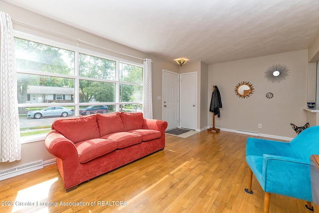 619 Wayland Ave, East Lansing, MI 48823 - living room featuring light wood-type flooring and baseboard heating