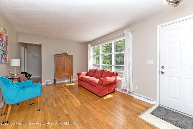 619 Wayland Ave, East Lansing, MI 48823 - living area featuring light wood-style floors and baseboards