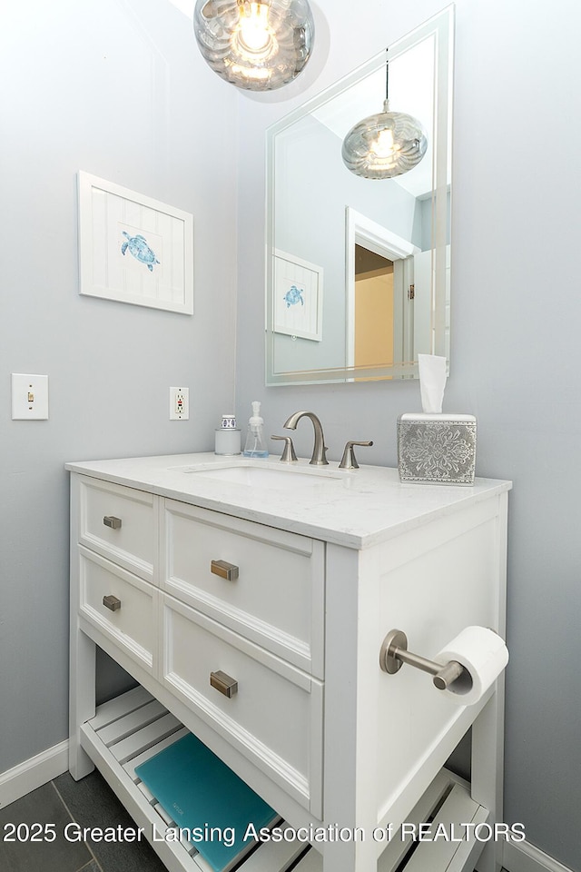 619 Wayland Ave, East Lansing, MI 48823 - bathroom with vanity and tile patterned flooring