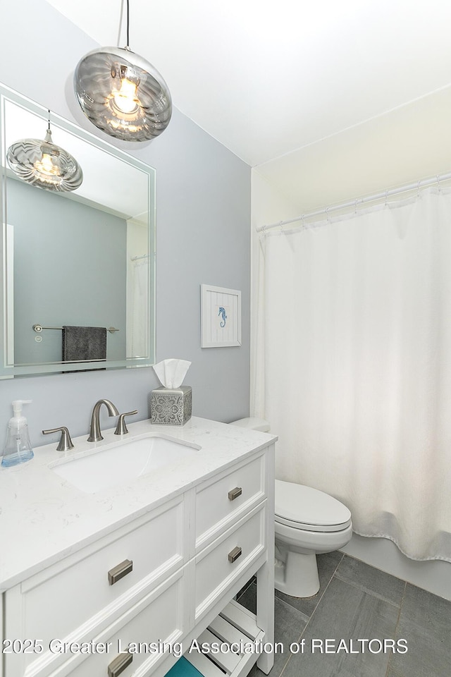 619 Wayland Ave, East Lansing, MI 48823 - bathroom with tile patterned flooring and vanity