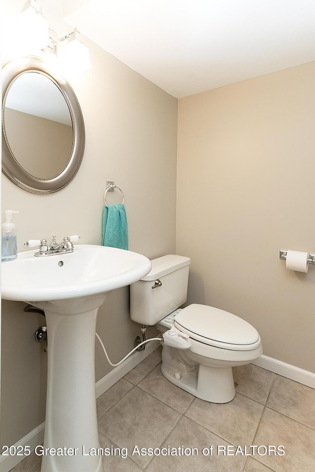 619 Wayland Ave, East Lansing, MI 48823 - bathroom featuring toilet and tile patterned floors