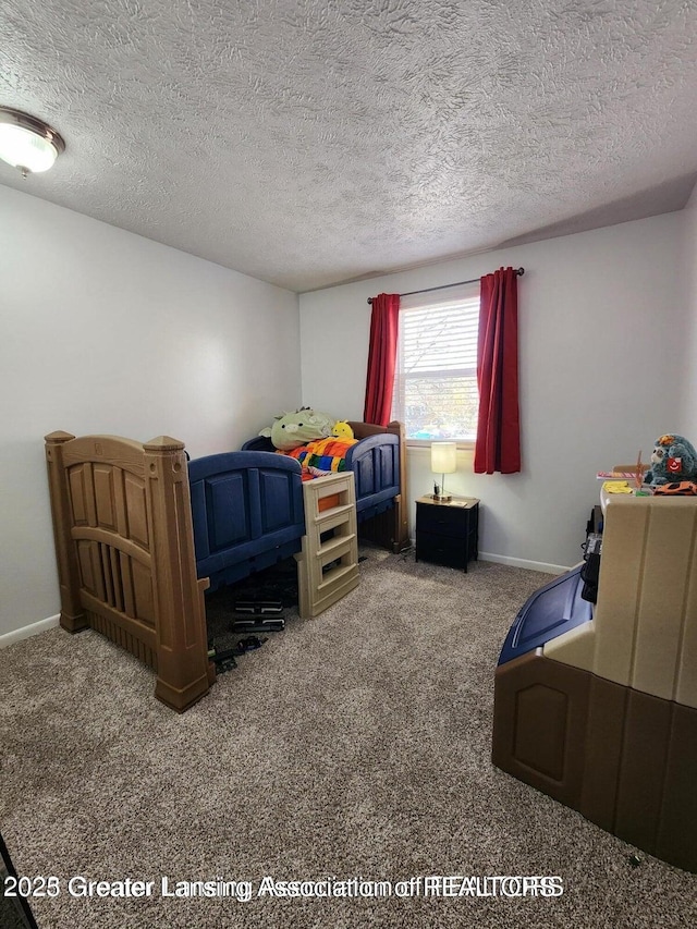 1755 Maisonette Dr, Lansing, MI 48911 - bedroom featuring carpet floors and a textured ceiling