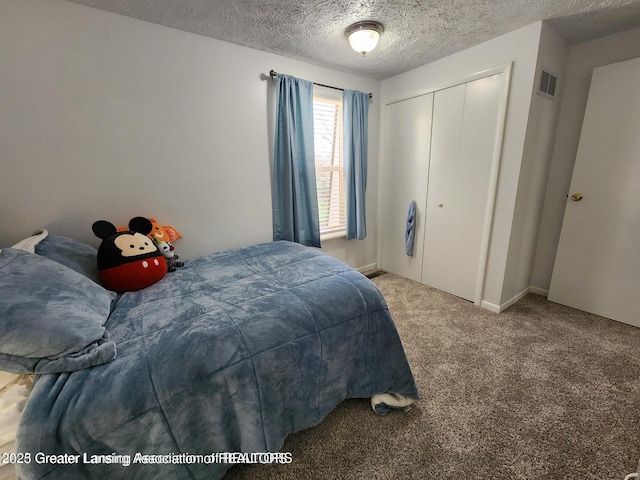1755 Maisonette Dr, Lansing, MI 48911 - carpeted bedroom with a closet and a textured ceiling