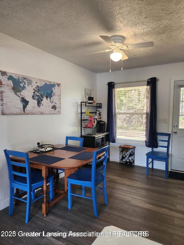 1755 Maisonette Dr, Lansing, MI 48911 - dining room featuring wood finished floors, a ceiling fan, and a textured ceiling