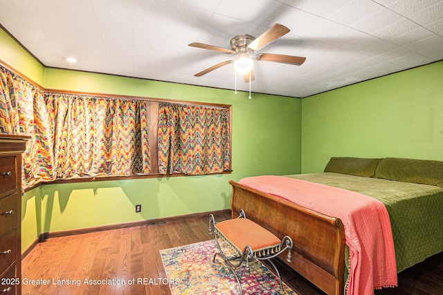 203 Branson Bay Dr, Mason, MI 48854 - bedroom featuring wood finished floors and ceiling fan
