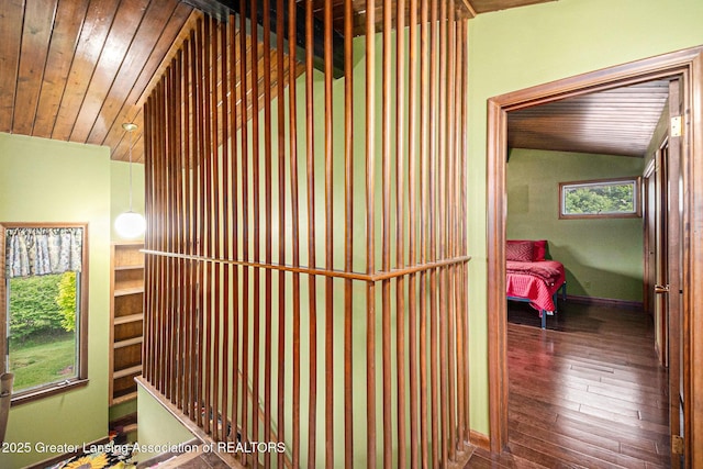 203 Branson Bay Dr, Mason, MI 48854 - corridor featuring lofted ceiling, wood ceiling, and wood-type flooring