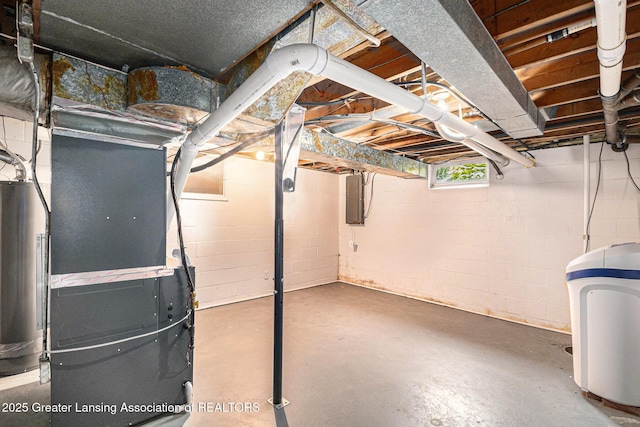 203 Branson Bay Dr, Mason, MI 48854 - unfinished below grade area featuring a water softener, heating unit, electric panel, and gas water heater