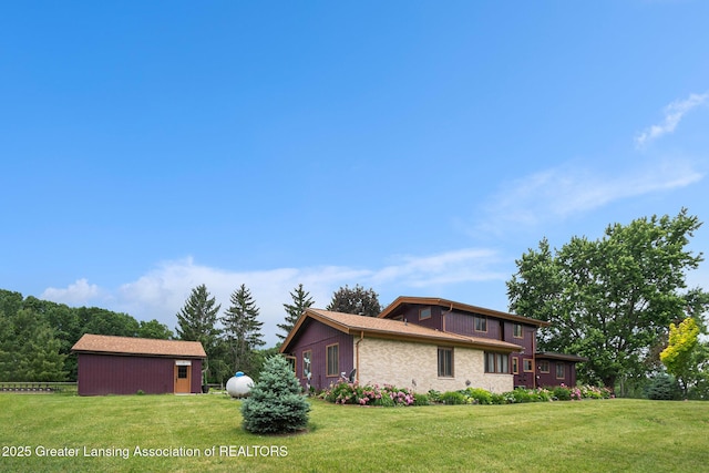 203 Branson Bay Dr, Mason, MI 48854 - view of property exterior featuring a lawn