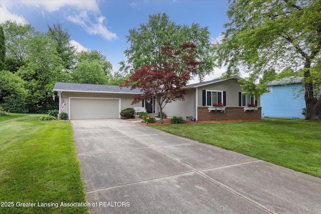 2130 Belding Ct, Okemos, MI 48864 - ranch-style home featuring a garage, a front yard, and concrete driveway