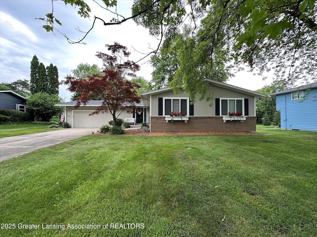 2130 Belding Ct, Okemos, MI 48864 - view of front of house featuring driveway, a front yard, and board and batten siding