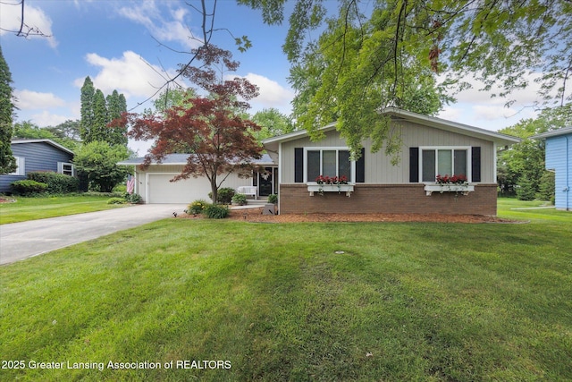 2130 Belding Ct, Okemos, MI 48864 - view of front of house featuring brick siding, concrete driveway, a front yard, and a garage