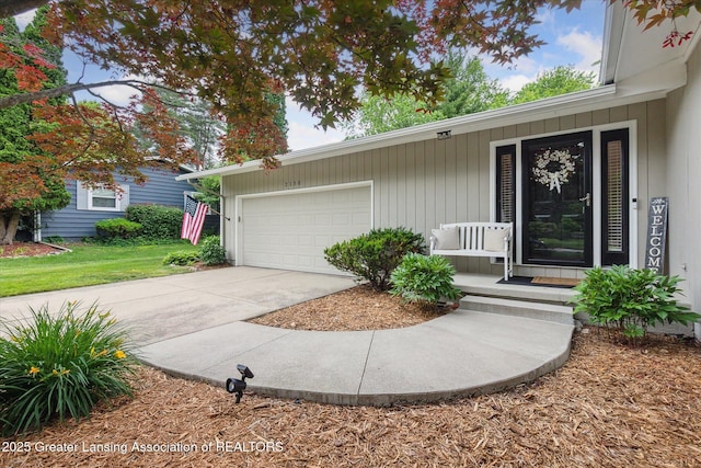 2130 Belding Ct, Okemos, MI 48864 - view of front of property featuring driveway, a garage, and a porch