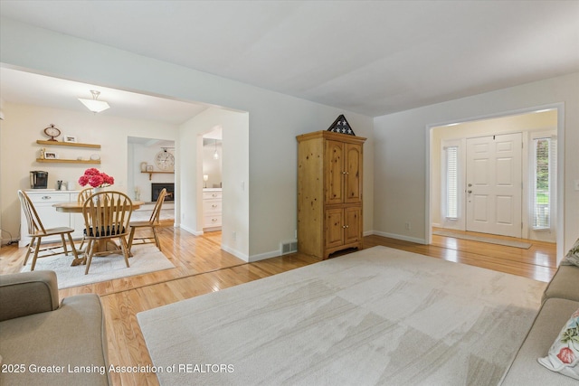 2130 Belding Ct, Okemos, MI 48864 - living area featuring wood finished floors and a fireplace