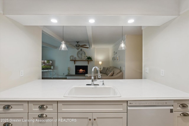 2130 Belding Ct, Okemos, MI 48864 - kitchen featuring dishwasher, a ceiling fan, open floor plan, a fireplace, and pendant lighting