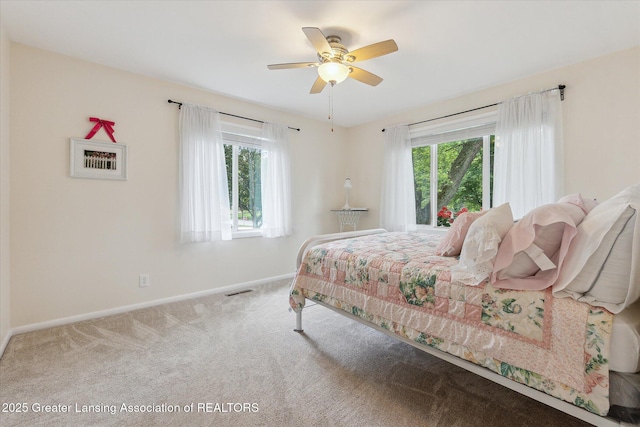2130 Belding Ct, Okemos, MI 48864 - carpeted bedroom with multiple windows and a ceiling fan