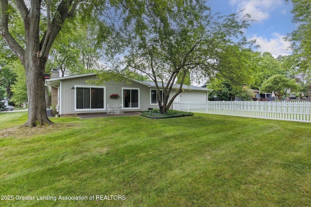 2130 Belding Ct, Okemos, MI 48864 - back of house featuring a chimney