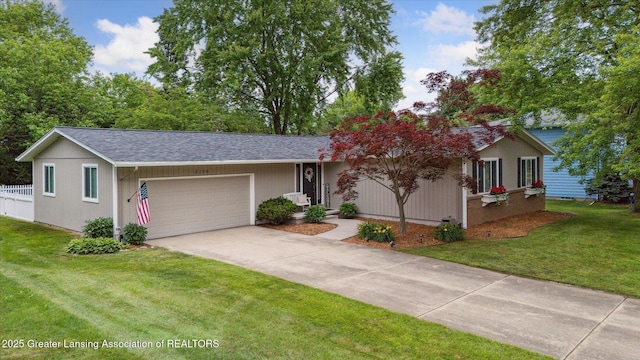 2130 Belding Ct, Okemos, MI 48864 - single story home featuring an attached garage, driveway, and roof with shingles