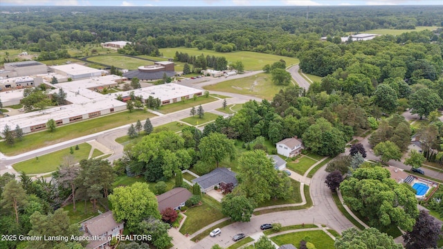 2130 Belding Ct, Okemos, MI 48864 - aerial view of property and surrounding area featuring a heavily wooded area
