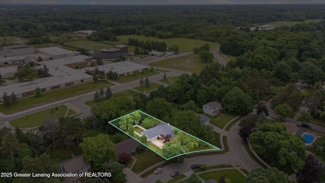 2130 Belding Ct, Okemos, MI 48864 - aerial overview of property's location featuring a forest and property boundaries highlighted