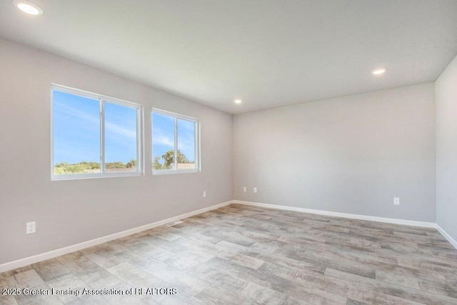 2905 Moccasin Dr, Dewitt, MI 48820 - empty room with healthy amount of natural light, recessed lighting, and light wood-style floors