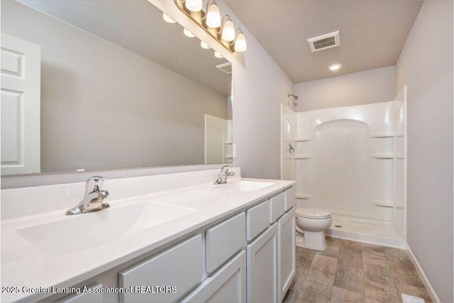 2905 Moccasin Dr, Dewitt, MI 48820 - full bathroom with a shower and double vanity