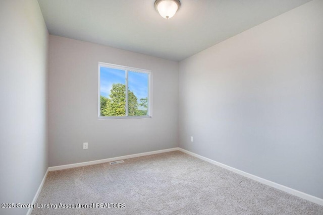 2905 Moccasin Dr, Dewitt, MI 48820 - carpeted spare room with baseboards