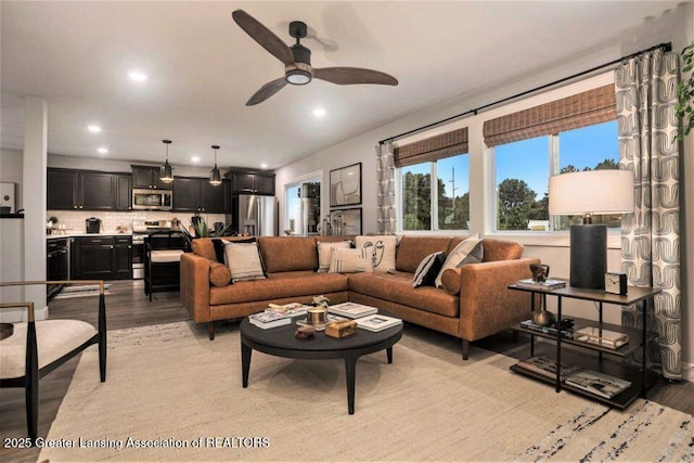 2905 Moccasin Dr, Dewitt, MI 48820 - living room with light wood-style floors, ceiling fan, and recessed lighting
