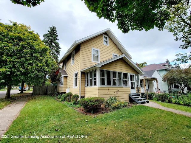 1201 Climax St, Lansing, MI 48912 - traditional-style home featuring a sunroom