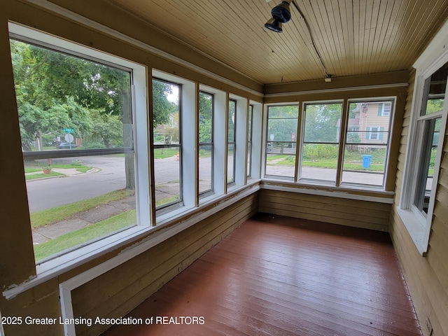 1201 Climax St, Lansing, MI 48912 - unfurnished sunroom with wood walls, wooden ceiling, and wood-type flooring